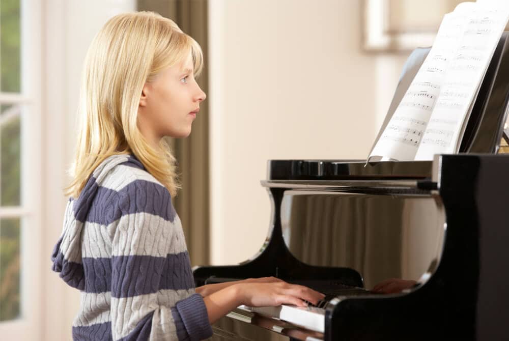 girl reading two clefs simultaneously