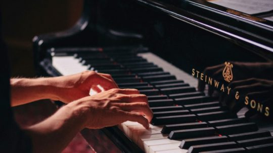 playing a classical solo piano piece